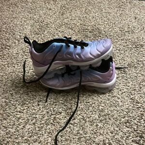 These are blue and purple Nike size 6.5 youth